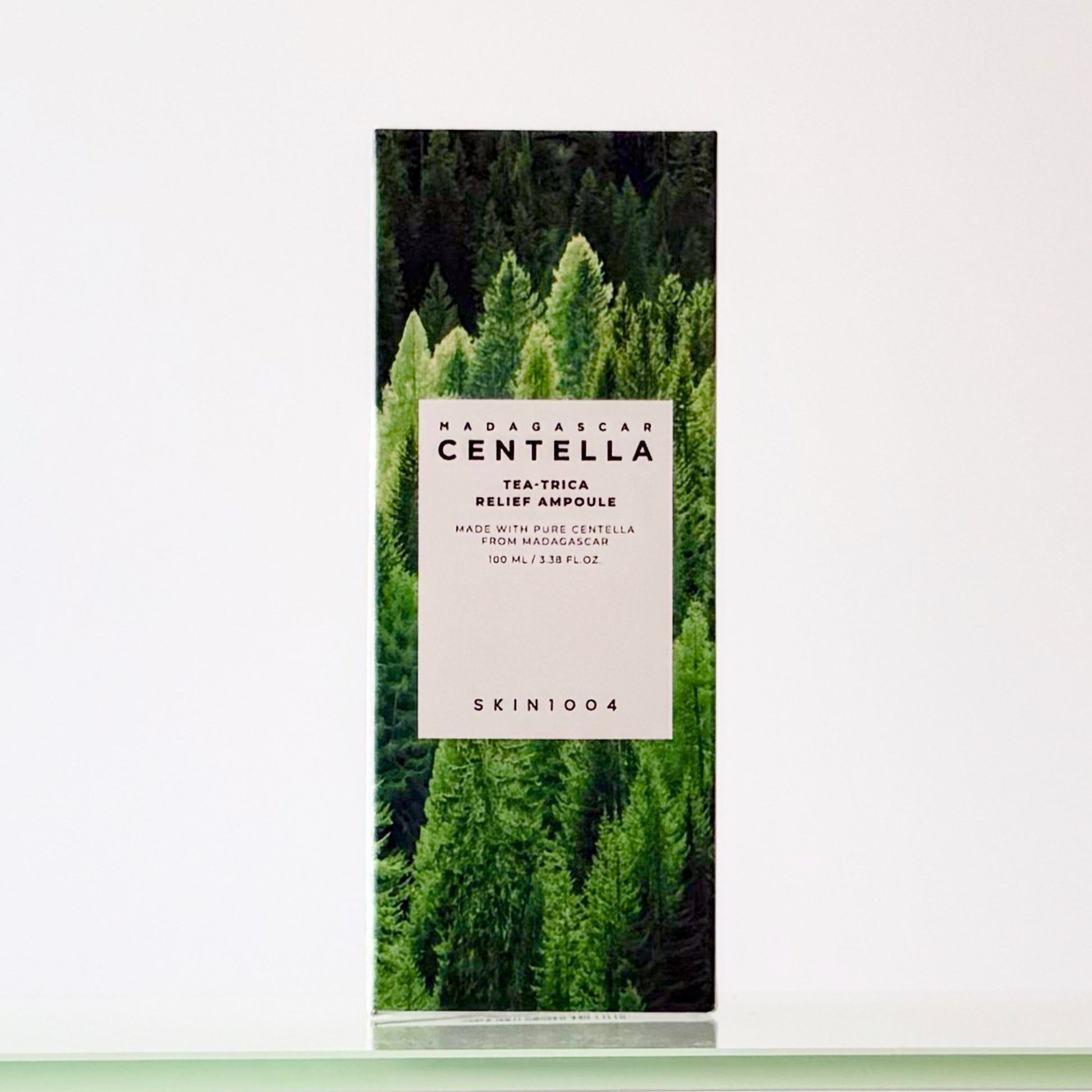 Product packaging with a forest design and visible branding on a white background